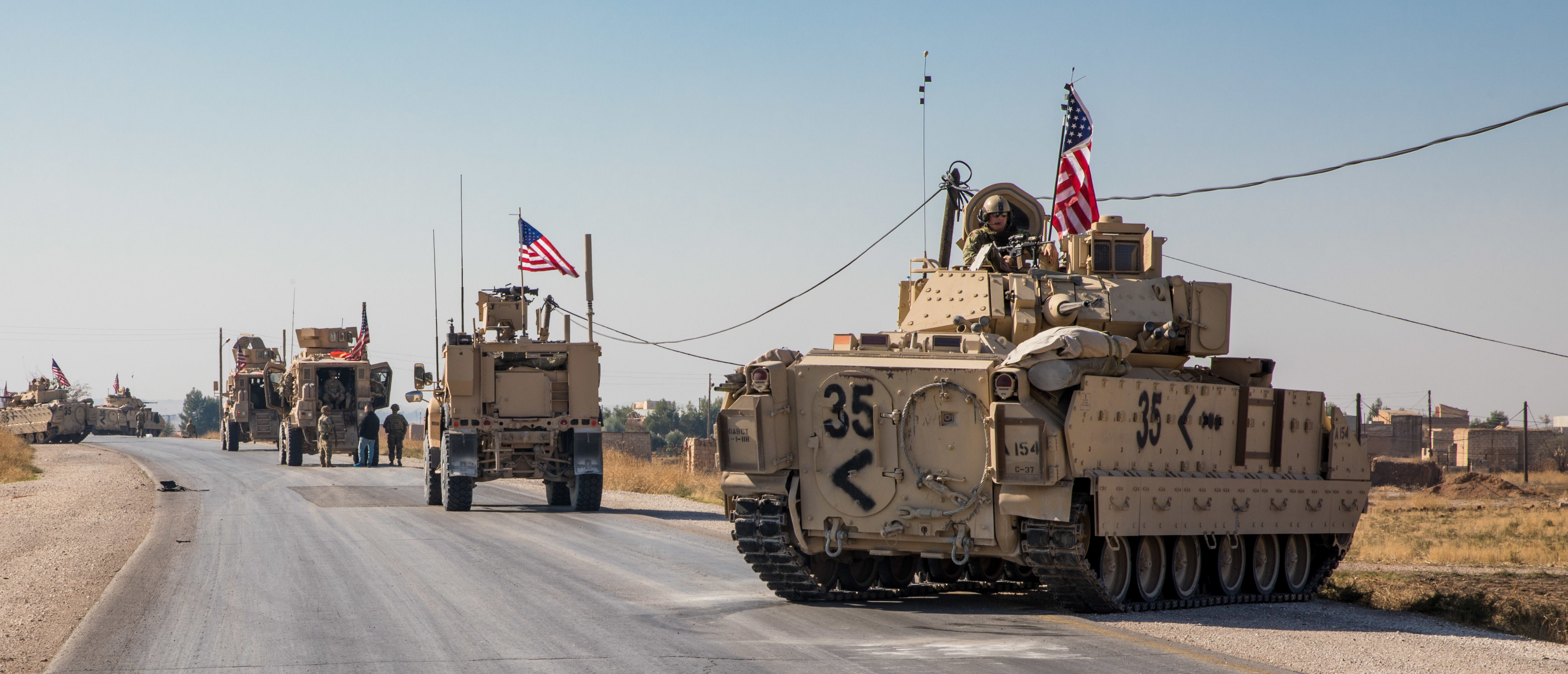 U.S. Soldiers in the 4th Battalion, 118th Infantry Regiment, 30th Armored Brigade Combat Team, North Carolina Army National Guard, attached to the 218th Maneuver Enhancement Brigade, South Carolina Army National Guard, provide M2A2 Bradley Fighting Vehicles for support to Combined Joint Task Force-Operation Inherent Resolve (CJTF-OIR) eastern Syria Nov. 10, 2019. The mechanized infantry troops partner with Syrian Democratic Forces to defeat ISIS remnants and protect critical infrastructure in eastern Syria.