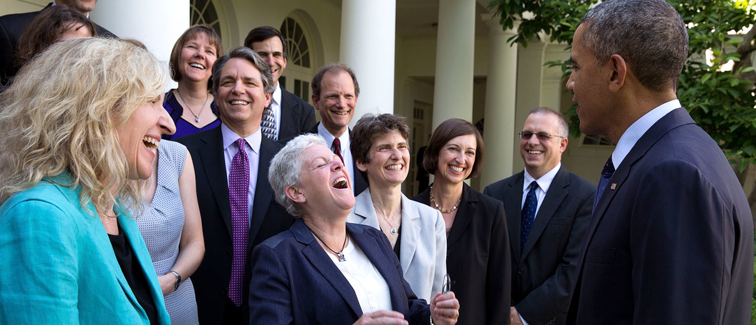 President Barack Obama jokes with Environmental Protection Agency Administrator Gina McCarthy and EPA staff members who worked on the power plant emissions standards, in the Rose Garden of the White House, June 2, 2014. (Official White House Photo by Pete Souza) This official White House photograph is being made available only for publication by news organizations and/or for personal use printing by the subject(s) of the photograph. The photograph may not be manipulated in any way and may not be used in commercial or political materials, advertisements, emails, products, promotions that in any way suggests approval or endorsement of the President, the First Family, or the White House.