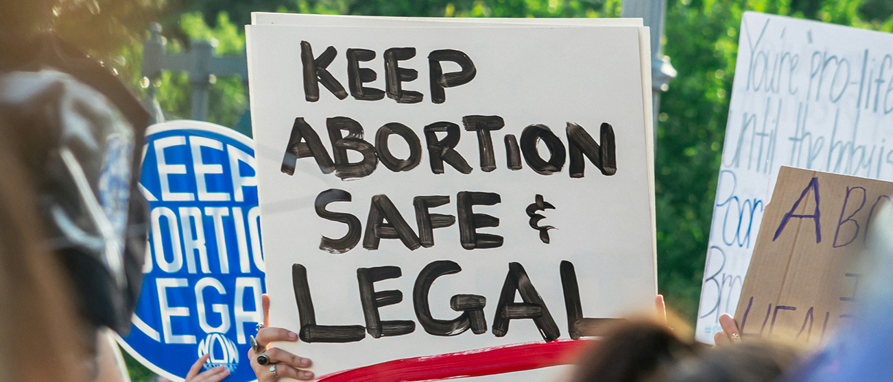 Demostrators carry sign saying Keep Abortion Safe and Legal at DC protest