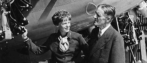 Photo of Amelia Earhart and Dr. Edward C. Elliott, president of Purdue University as Earhart with the Lockheed Electra she later disappeared in. Purdue University paid for the plane as Earhart was then a consultant on aeronautics there. [Wikimedia Commons/Public Domain/World Wide Photos]