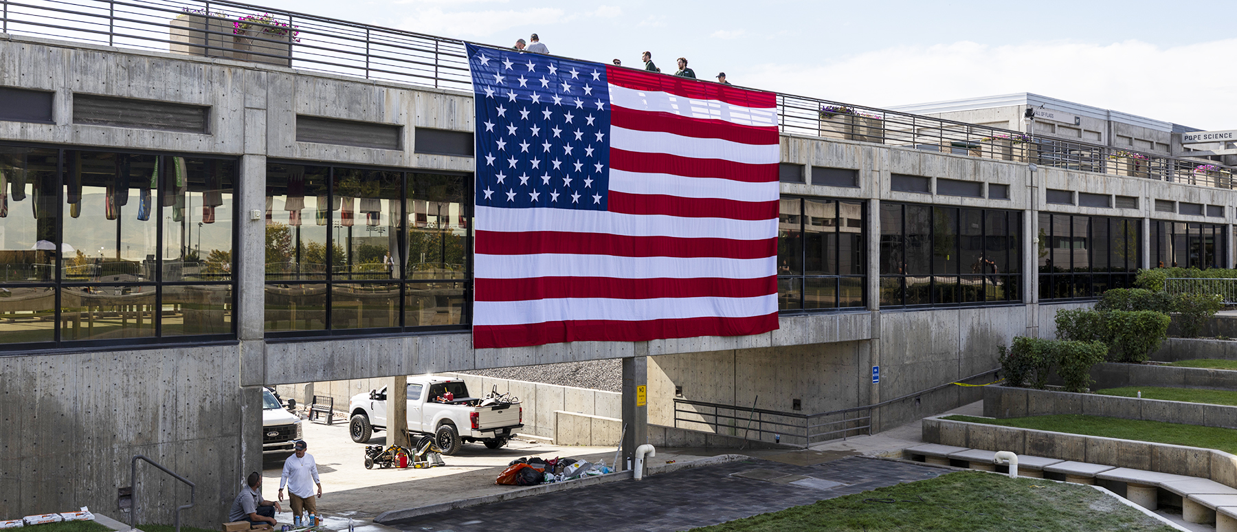 Utah Valley University - Giant American Flag is installed in the courtyard where conservative leader Charlie Kirk was gunned down while speaking at on the UVU Campus in Orem, Utah on Monday, September 15, 2025.