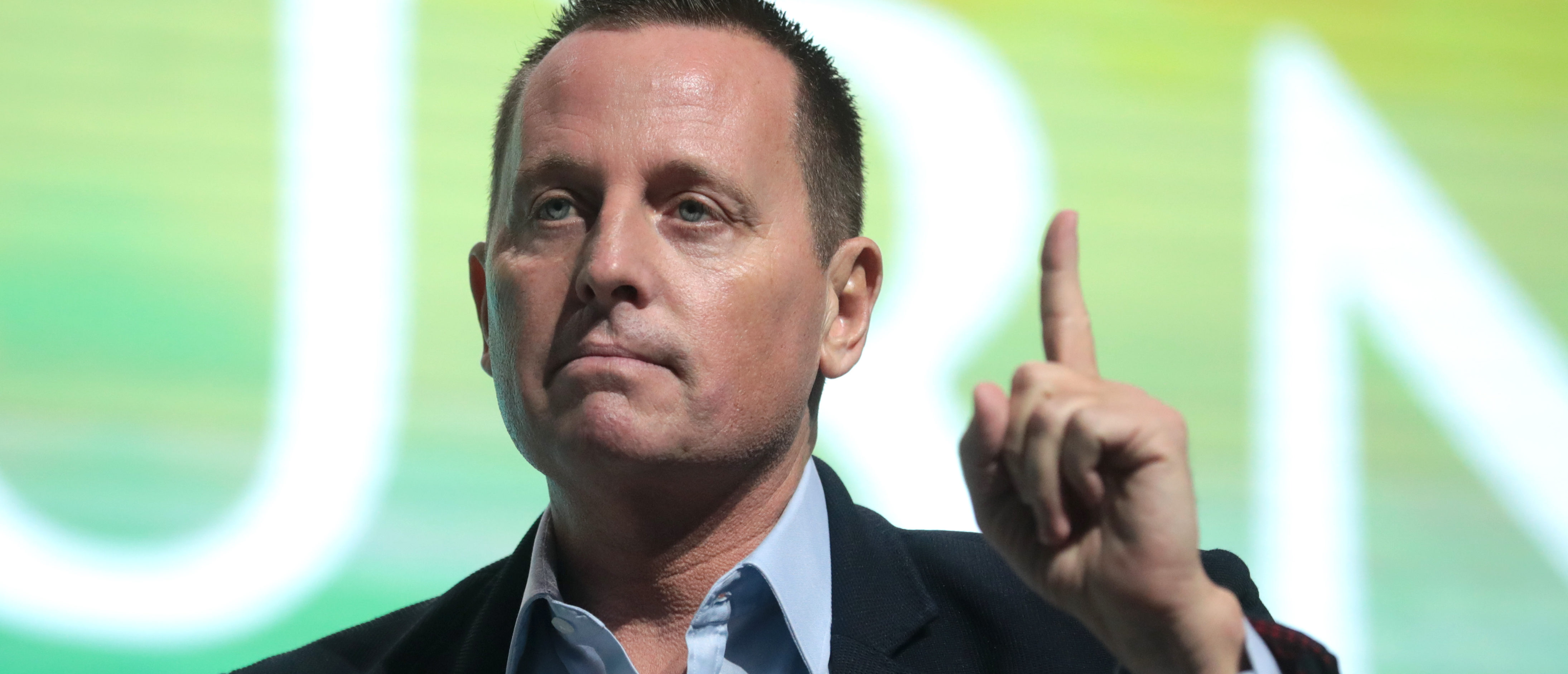 U.S. Ambassador to Germany Richard Grenell speaking with attendees at the 2019 Student Action Summit hosted by Turning Point USA at the Palm Beach County Convention Center in West Palm Beach, Florida. [Wikimedia Commons/Public/Gage Skidmore, CC BY 2.0 ]