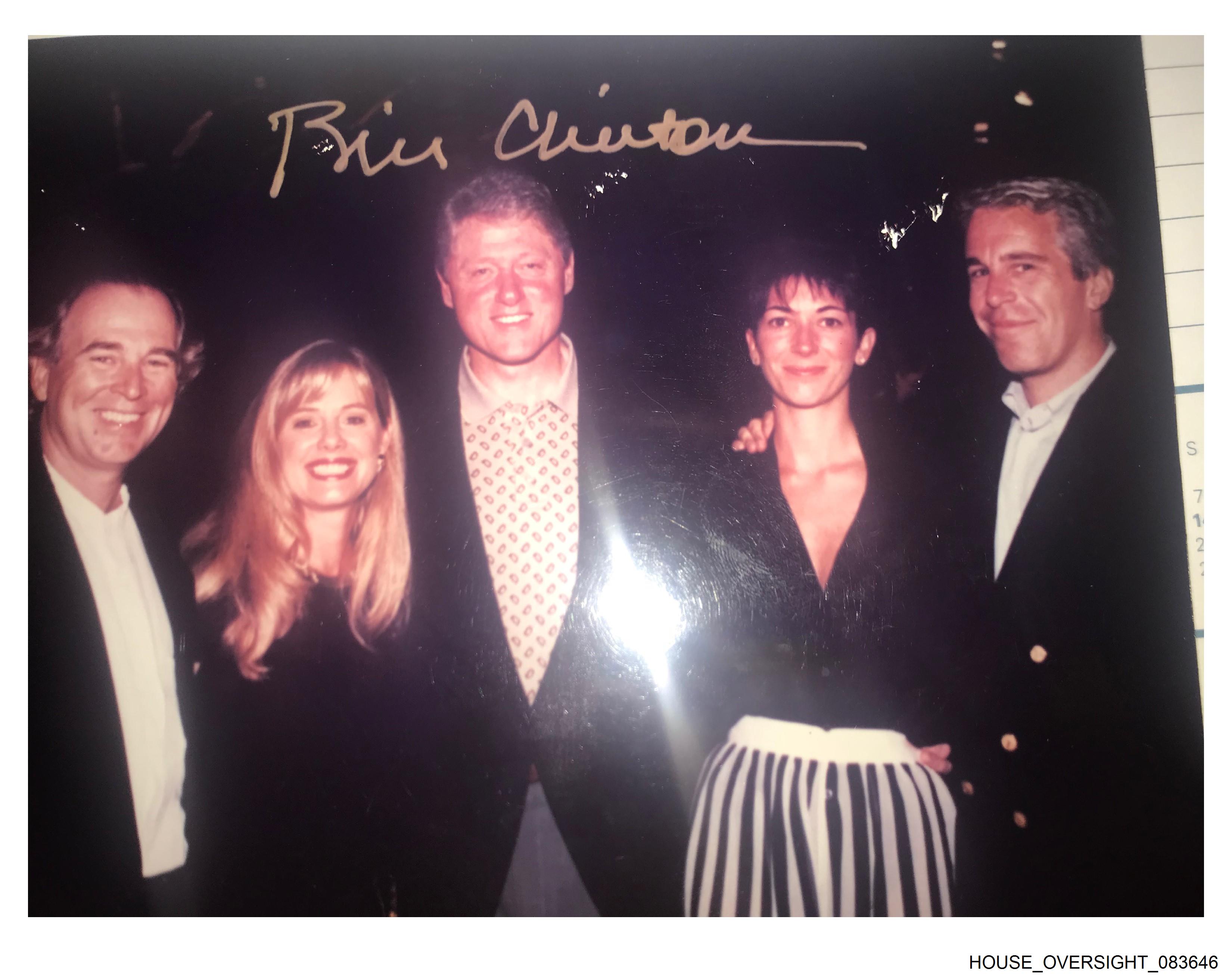 Undated photo of former President Bill Clinton posing with Jeffrey Epstein and Ghislaine Maxwell.