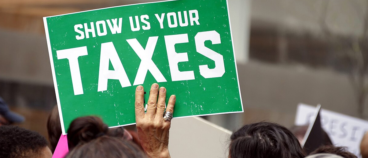 So-called resistance protesters march to demand Trump release tax returns.