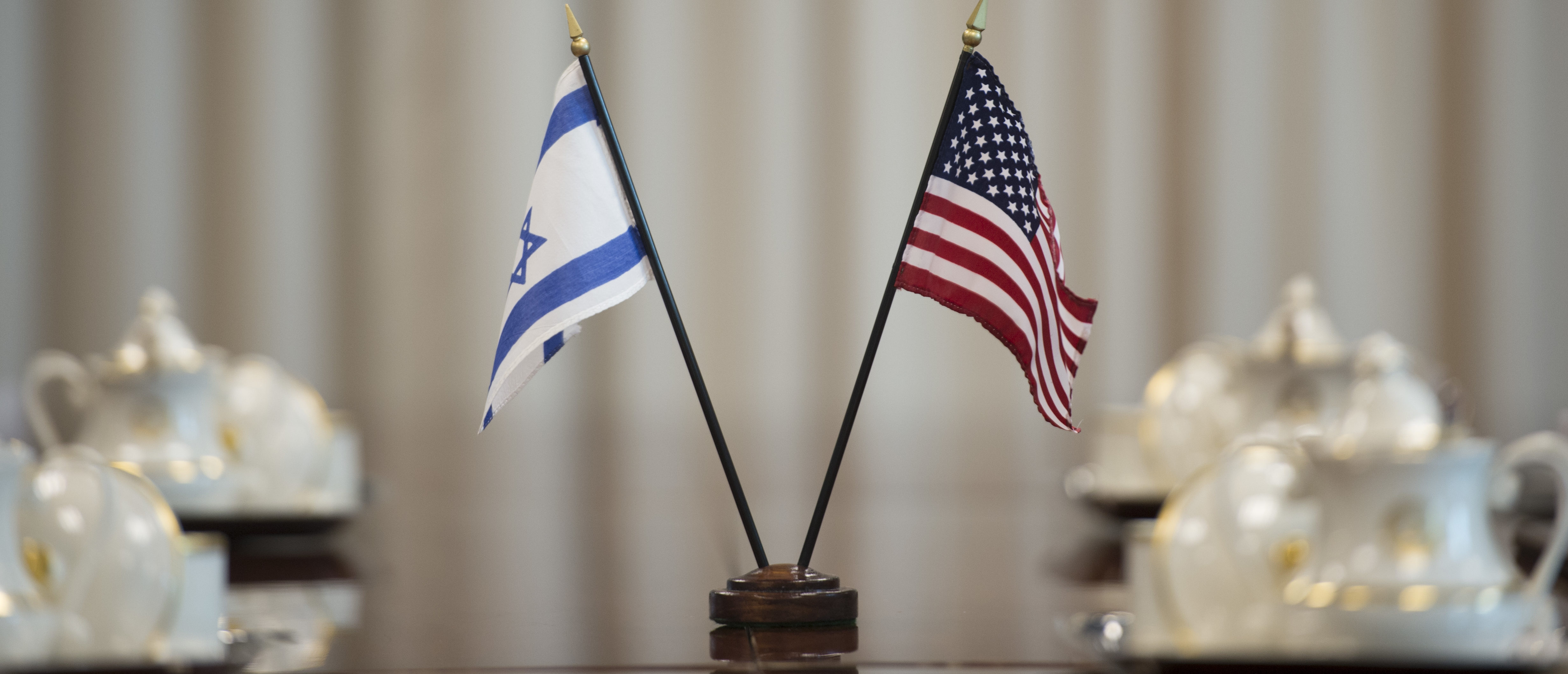 An American and Israeli flag sit on a conference table as Deputy Secretary of Defense Bob Work prepares to meet with Israeli Director General of the Ministry of Defense Dan Harel at the Pentagon in Washington D.C., to discuss matters of mutual importance Oct. 20, 2014, 2014. (DoD Photo by Master Sgt. Adrian Cadiz)(Released)